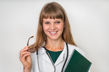 Portrait Of Successful Doctor With Stethoscope On White