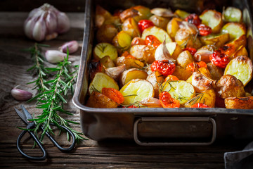 Wall Mural - Crispy roasted potato with tomato, salt and garlic