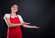 © Catalin Pop - Happy female with red apron invinting you in