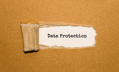 Canvas Print - The text Data Protection appearing behind torn brown paper