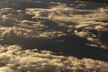 Wall Mural - Sunset White Cloud sky at high level attitude, view from window airplane