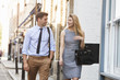 © Monkey Business - Businessman And Businesswoman Walk to Work Through City Street