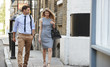 © Monkey Business - Businessman And Businesswoman Walk to Work Through City Street