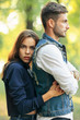 © GVS - Young beautiful woman embracing her man from back outdoors