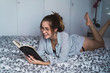 © Kike Arnaiz/ADDICTIVE STOCK - Attractive woman with book