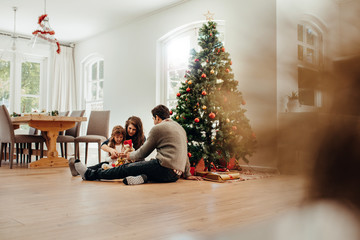 Small family celebrating Christmas.