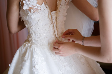 Wall Mural - beautiful bride dress decorated with beads and lace