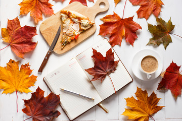 Wall Mural - autumn breakfast with coffee, pizza and diary. top view concept