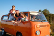Hippie friends in a van on a road trip