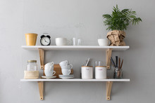 Utensils And Mugs On Shelf