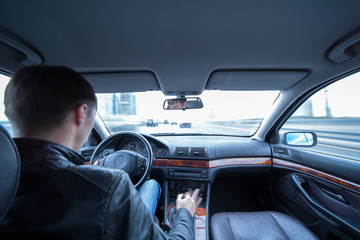 Canvas Print - Hands on steering wheel of a car driving