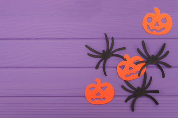 The spiders and pumpkins halloween silhouettes cut out of paper