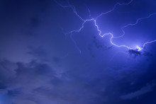 Thunder Storm Lighting Bolts In Blue  Sky Splitting And Hit The Sky Twice