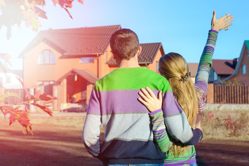 Wall Mural - young couple near his house