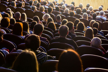 People in the auditorium during the performance. A theatrical production.