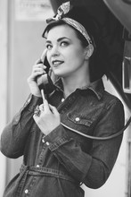 Young Pin-up Woman With Vintage Street Telephone