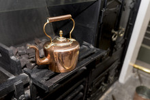 Vintage And Antique Copper Kettle On A Victorian Stove In A Traditional Victorian Kitchen