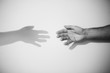 © Jovana Rikalo/Stocksy - Hands reaching shadow