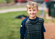 © Kelly Knox/Stocksy - portrait of a young baseball player
