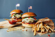 © Ellie Baygulov/Stocksy - Homemade cheeseburgers and fries