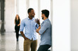 © seanlockephotography - Workspace: Work Friends Having Discussion In Hallway
