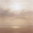 © PaulEdmondson/Stocksy - Abstract of setting sun over vast ocean and clouds