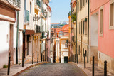 Fototapeta Uliczki - Old narrow street in Lisbon. Portugal view
