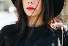 Portrait Of A Young Alternative Woman With A Nose Ring And Red Lips.
