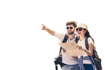 multi ethnic couple look at map while pointing finger in the direction of destination. travel concep