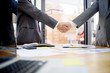 © Prathankarnpap - businessman shaking hands finishing up a meeting,acquisition concept.