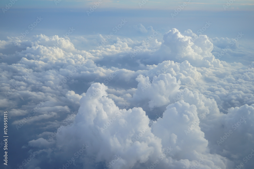 View of beautiful heaven cloudscape with shades of blue sky background from flying plane window - obrazy, fototapety, plakaty 