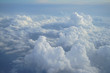 View of beautiful heaven cloudscape with shades of blue sky background from flying plane window