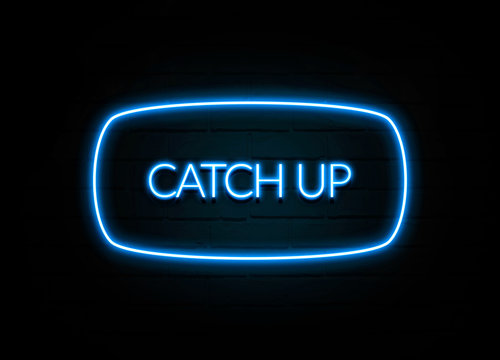 Catch Up  - colorful Neon Sign on brickwall