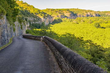 Landscape of road and cliff in the valley of the Dordogne, france