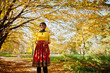 © AS Photo Family - African american girl at yellow and red dress at golden autumn fall park.