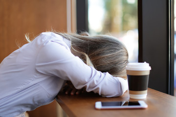 Canvas Print - Young tired woman in cafe