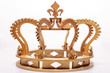 close-up of golden royal crown on white background