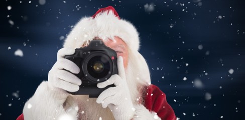 Canvas Print - Composite image of santa is taking a picture