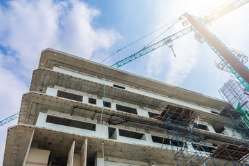 Wall Mural - construction site and crane with blue sky