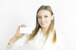 © ALEXEY - girl with a pure business card. A young girl holds a clean card in her hand with your inscription. White isolated background