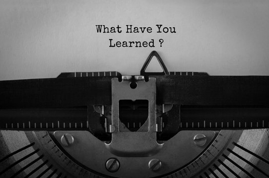 Text What Have You Learned typed on retro typewriter
