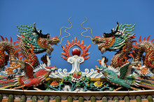 Colorful Ceramic Dragons On Top Of A Chinese Temple