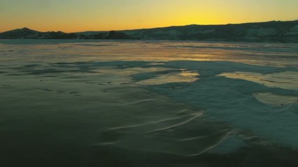 Wall Mural - Winter lake landscape at sunset
