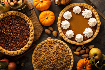 Wall Mural - Fall traditional pies pumpkin, pecan and apple crumble