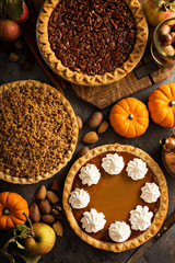 Wall Mural - Fall traditional pies pumpkin, pecan and apple crumble