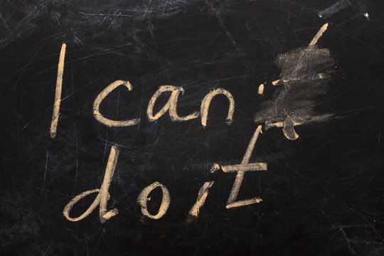 Changing the word I can't to I can do it text on  blackboard background