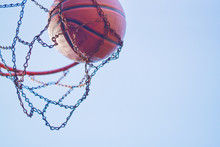 Basketball Shot Threw Chain Netting On Hoop