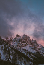 Snowcovered Rugged Mountain Range In The Italian Alps At Sunset