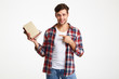 © Drobot Dean - Portrait of a smiling male student holding books