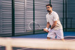 Man on tennis court